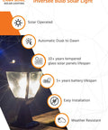 Inversee Outdoor Solar Post Light With 3 Mount Options emitting warm white LED light on a wooden surface at night.