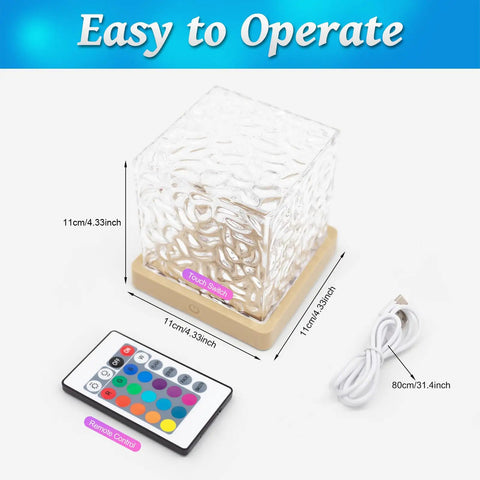Ocean Wave Projector Light With 16 RGB Colors And Four Modes, Remote Control, cube design lamp next to remote, USB cable