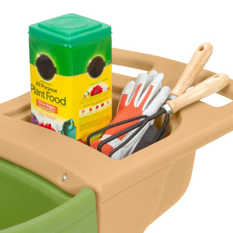 Top view of Easy Haul Wheelbarrow Green Garden Cart for yard work with tools and plant food on handle tray