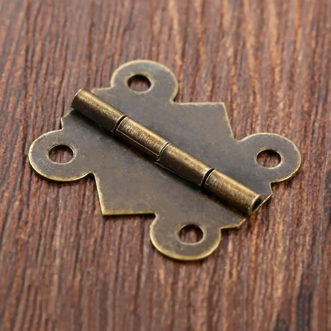 Forty Piece Mini Butterfly Door Hinges In Antique Bronze For Cabinets Drawers Jewelry Boxes And Furniture Fittings Ideal For DIY Projects And Refurbishments Ornamental Hardware Easy Install 20x25mm on wood surface