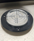 50Mm Circular Level Vial, Black For Acrylic Bubble Indicator showing level markings and calibration on a flat surface.