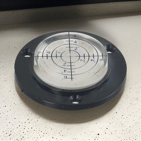 50Mm Circular Level Vial, Black For Acrylic Bubble Indicator showing level markings and calibration on a flat surface.