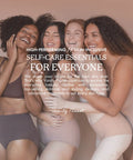 Group of women in neutral-toned underwear embracing, representing self-care and inclusivity for all skin types.