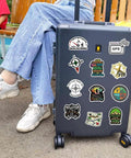 50 Piece Waterproof Geocaching Stickers Pack Vinyl Decals For Water Bottles Laptops Luggage Bicycles Skateboards Computers And More Rad Adventure Gear Decor displayed on suitcase