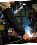 Welding in a workshop wearing Tough As Nails Heat Resistant Welding Sleeves Fire Retardant Arm Protectors For Mechanics And Grinders Black.