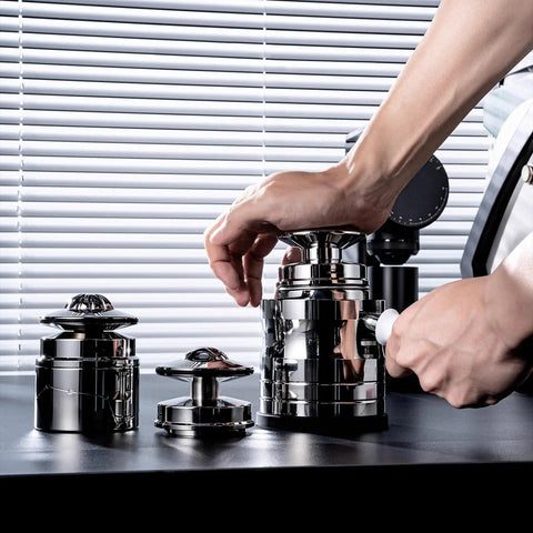 Person using a spring-loaded tamper from the Straight Up Pro Grade 58Mm Espresso Accessories Kit on a countertop.