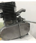 Gas-powered 2-stroke bicycle engine; side view with finned cylinder and clutch lever