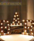 Light Up BAR Sign LED Marquee Letter For Home Bar And Party Decor on tabletop, vintage style illuminated with warm LEDs