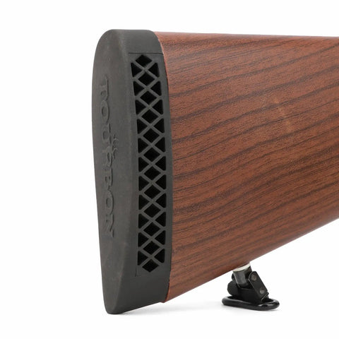 Close-up of Grind-To-Fit Recoil Pad For Rifles And Shotguns, Silicone Buttstock Pad In Black on wooden rifle stock.