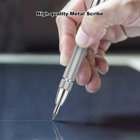 Hand using scribing pen from 4 Pack Tungsten Carbide Scriber Tool Set With Magnet, Pro Grade Metal Engraving Pen on smooth surface