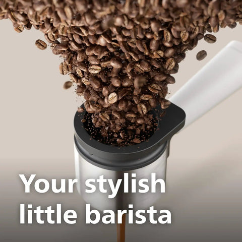 Bean To Cup Espresso Maker Featuring A Built In Grinder And Auto Milk Frother Delivering Thick Microfoam With A Rock Solid 16 Bar Pump pouring coffee beans.