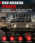 Front view of an SUV equipped for off-road recovery, featuring a high-strength winch rope and protective sleeve in rugged terrain.
