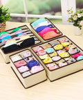 Total Closet Game Changer Non Woven Bra Storage Organizer With Multi Grid Layout Smooth Drawer Setup For Underwear Socks Ties And Scarves Beige Four Pack displayed neatly with bras and rolled socks.