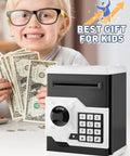 Child smiling with Electronic Piggy Bank For Kids With Password Protection And Automatic Money Scroll Save Box on table