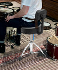 Solid As A Rock Drum Throne Stool With Plush Memory Foam Backrest shown with adjustable height and swivel base for drummers.