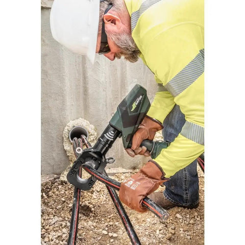 Operating Heavy Duty Gator Remote Cable Cutter Bare Tool With Wireless Remote on soft metal cables for underground telecom.