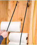 Person using 32 Inch Heavy Duty Bungee Cords With Hooks 8mm Elastic Rope For Outdoor Camping Tarp Tie Down Kayak Cargo Securing UV Resistant Stretch Rope S Hooks Durable to hang paper towels in a wooden structure.