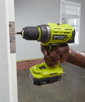Badass 18V Brushless Cordless Drill With 13Mm Quick-Load Chuck And 24 Torque Settings For Crushing Wood Metal Ceramic And Tile Tasks No Drama Required Bare Tool Setup No Battery Or Charger In The Box, drilling into a door hinge.