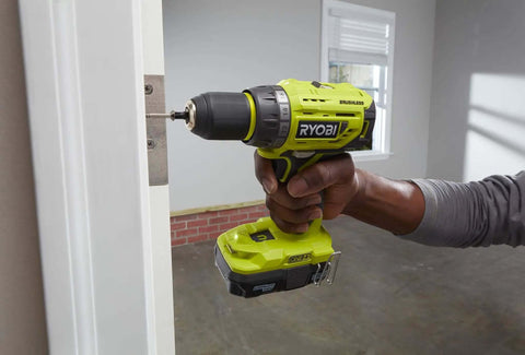 Badass 18V Brushless Cordless Drill With 13Mm Quick-Load Chuck And 24 Torque Settings For Crushing Wood Metal Ceramic And Tile Tasks No Drama Required Bare Tool Setup No Battery Or Charger In The Box, drilling into a door hinge.