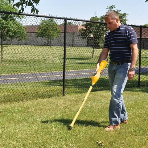 Man using a Rugged Magnetic Locator With Slick One-Handed Ergonomic Grip And Dead On Digital Readout for underground detection.