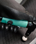 Bad Boy Pneumatic Right Angle Die Grinder Cranking 22000 RPM for swift grinding held in gloved hand on rubber surface.