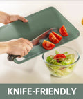 Set Of 3 Plastic Cutting Boards For Kitchen BPA Free Non Slip Dishwasher Safe Reversible With Grip Handles slicing tomatoes