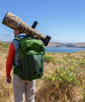 BackLight 36L Outdoor Adventure Camera Daypack Backpack in Woodland Green on hiker with camera gear, overlooking scenic view