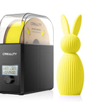 Filament Dryer Box Pro With Fan For 3D Printing, 360 Degree Heating Dehydrator next to yellow 3D-printed bunny model.