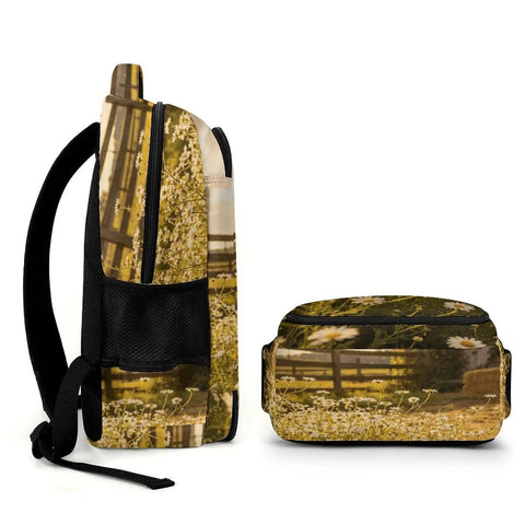 Side view of Sunset Daisy Barn Farm Printed Unisex Backpack with large capacity, durable polyester, showing floral design