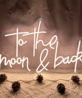 To The Moon And Back LED Neon Light Sign with Adjustable Brightness showing warm white glow in cozy decor setting