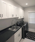 Brookings Shaker Unassembled Sink Base Cabinet 36 W 24 D 34.5 H Painted White Solid Wood installed in laundry room with sink