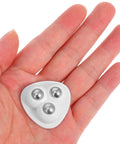 Heavy Duty 8 Piece Adhesive Universal Caster Wheels For Furniture And Bedside Tables Featuring Smooth As Butter Rolling Stainless Steel Swivel Casters With Top Shelf Build Quality in hand showing three ball bearings.