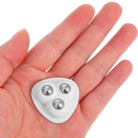 Heavy Duty 8 Piece Adhesive Universal Caster Wheels For Furniture And Bedside Tables Featuring Smooth As Butter Rolling Stainless Steel Swivel Casters With Top Shelf Build Quality in hand showing three ball bearings.
