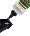 Applying Go-To Odorless Coconut-Derived Clipper Oil, 8 Oz Large Bottle to hair clipper blades for maintenance.