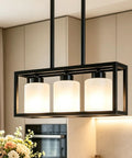 ROCUNSI 3-Light Black Kitchen Island Lighting with adjustable height and frosted glass shades in modern kitchen setting.