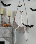 3 Foot Full Body Halloween Skeleton Decoration For Party And Haunted House hanging next to candles on decorated mantel