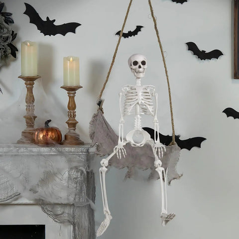 3 Foot Full Body Halloween Skeleton Decoration For Party And Haunted House hanging next to candles on decorated mantel