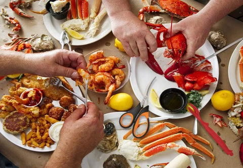 20 Pack Seafood Crackers And Tools Set Party Ready Gear Includes 6 Crab Crackers 6 Lobster Shellers 6 Crab Leg Forks And 2 Stainless Steel Seafood Scissors displayed on table with seafood dishes.