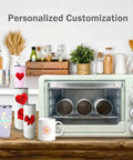 22 Liter Sublimation Oven For Crafting Mugs Tumblers Water Bottles With 110 Volt 1500 Watt Convection Heating on a wooden table with mugs and tumblers.