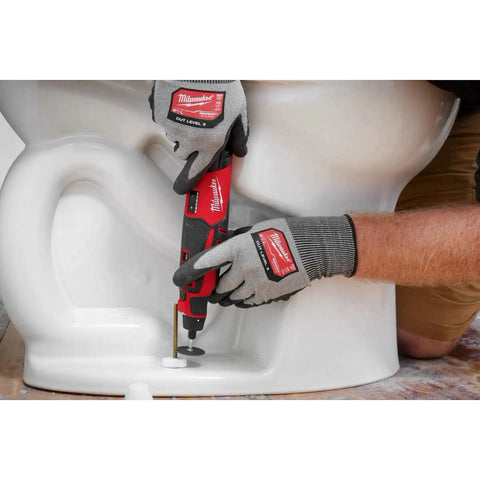 Pro Grade M12 Cordless Brushless Rotary Tool With Snappy Variable Speed Dial And 12 Precision Settings delivering precise cuts on a toilet.