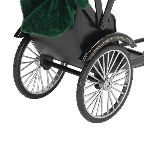 Vintage Red Zinc Alloy Rickshaw Model Toy With Sick Hand Painted Details And A Clean Finish That Hits Different on desk close up of wheels and body