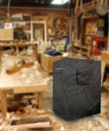 Built Tough Table Saw Cover With Waterproof Jobsite Weather Guard And Integrated Tool Storage Pockets For Contractor Shop Equipment And All Season Protection in a workshop setting.