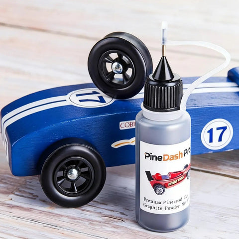 Graphite Powder Lubricant 0.5 Oz for Pinewood Derby Cars and Wheels Axles with blue derby car and nozzle bottle