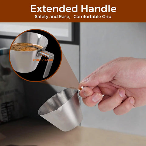 Hand holding two pack stainless steel espresso cup with handle, double spout measuring cup with dual scale, V shaped mouth, 3.4oz 100ml