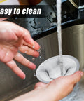 Stainless Steel Sink Strainer 12 Pack Heavy Duty Mesh Sieve Catches Food Gunk And Hair No Sweat Drain Catcher With Rust Proof Build That Nails Kitchen Cleanup For All Basins being rinsed under water.