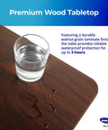 Height Adjustable Overbed Table With Straight Up Sturdy L Shaped Welded Steel Base And Smooth Rolling Precision Lock Casters Legit Durable Hospital Or Home Use Waterproof tray showing water glass on walnut-grain surface.