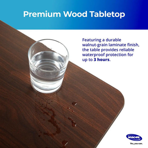 Height Adjustable Overbed Table With Straight Up Sturdy L Shaped Welded Steel Base And Smooth Rolling Precision Lock Casters Legit Durable Hospital Or Home Use Waterproof tray showing water glass on walnut-grain surface.