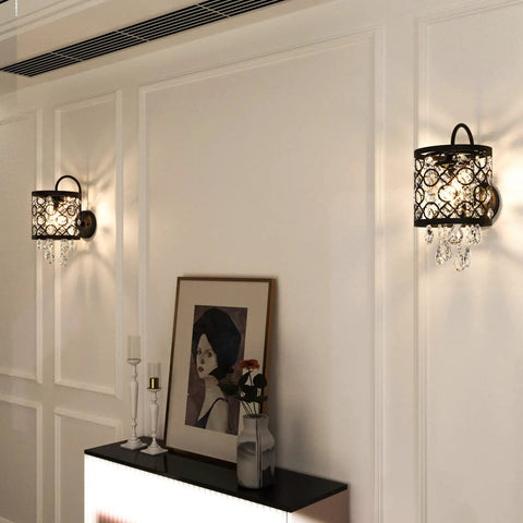 Crystal Wall Sconce Set Of 2 Indoor Wall Lamps With Lattice Drum Shade For Bedroom Bedside Living Room Black Finish Durable Solid Metal Construction Slick Modern Home Decor mounted on a white wall next to artwork.