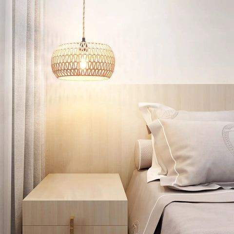 Real Deal Plug In Pendant Light Featuring Woven Rattan Shade And Hassle Free On Off Switch above bedside with lamp illuminating cozy bedroom.