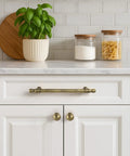 Brushed Antique Brass Cabinet Knobs Set 10 Pack Solid Zinc Alloy Drawer Knobs on white kitchen cabinets
